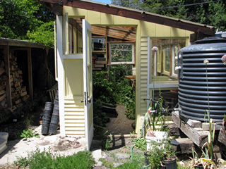 firewood, greenhouse and water tank